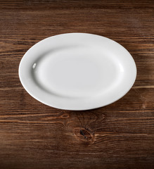 white plate on wooden table