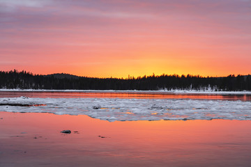 Bright winter sunset on the White sea, the Bay near the village Nilmoguba, Karelia, Russia