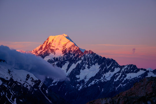 Scenic sunset view of Mt Cook summit with colorful sky, NZ