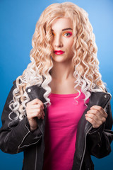 Beautiful blonde girl on a blue background