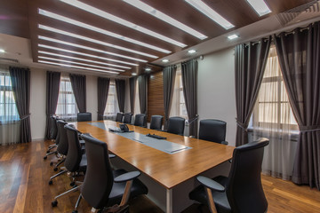 Modern meeting room with solid wood table