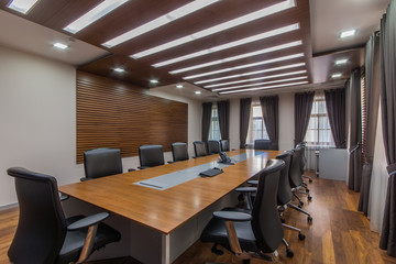 Modern meeting room with solid wood table
