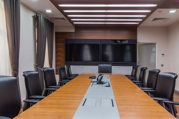 Modern meeting room with wide screen TV