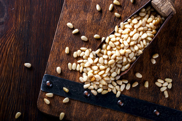 Pine Nut , in Vintage shovel on Wooden Background.Vegetarian.Concept of Healthy Food.Copy space. selective focus.