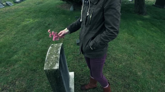 Visiting Headstone at Cemetery and Mourning or Remembering