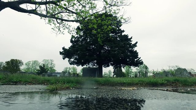 Visiting Headstone at Cemetery and Mourning or Remembering
