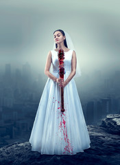 Bride in white wedding dress with bloody bat