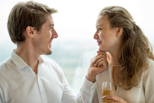 Happy Young Man Touching Chin Of His Girlfriend