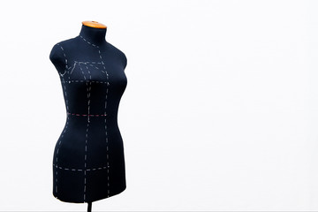 Black women sewing mannequin with main marks for removing of measures standing on a white background