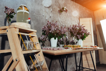 Canapes and drinks a desserts on the buffet table