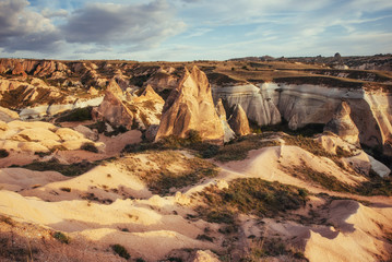 Fototapeta na wymiar Unique geological formations in valley in Cappadocia