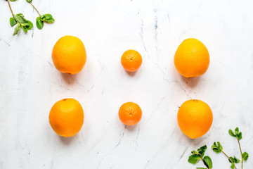 Tasty oranges for cooking smoothie on white background top view mockup