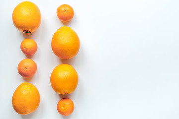 Orange fruits on white background top view mock up