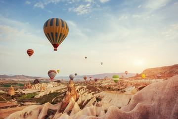 Turkey Cappadocia beautiful balloons flight stone landscape - obrazy, fototapety, plakaty