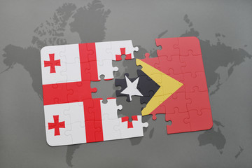 puzzle with the national flag of georgia and east timor on a world map