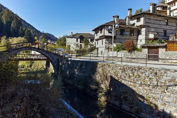 Naklejka premium Autumn Landscape with Roman Bridge and old houses in town of Shiroka Laka, Smolyan Region, Bulgaria