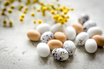 Easter card with eggs and flower on light background