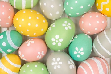Full background of colorful, pastel, hand painted Easter eggs