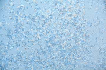 Fototapeta na wymiar beautiful winter texture patterns of frost on window
