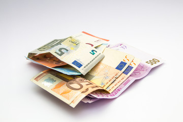 Obraz na płótnie Canvas Euro Money banknote and coins isolated white background