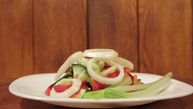 Healthy salad with fresh vegetables. Dietetic foods from environmentally friendly organic products. Vegetables from his garden. Slow rotate (1080p 25 fps; canon 7d, Sigma 24-70)