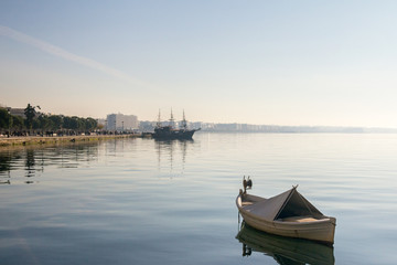 Fototapeta premium Boats and ships on the Aegean sea on Thessaloniki seafront in Greece.