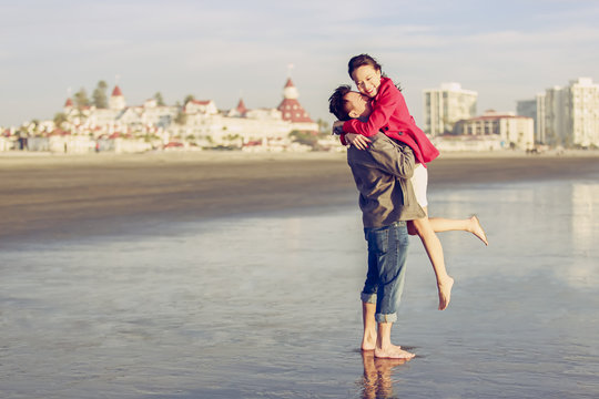Happy young couple enjoy being at the beach