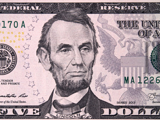 Abraham Abe Lincoln on USA five dollar bill close up, 5 usd, United States of America money closeup