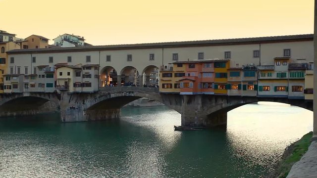 Side view at sunset of Ponte Vecchio in Florence, Italy.