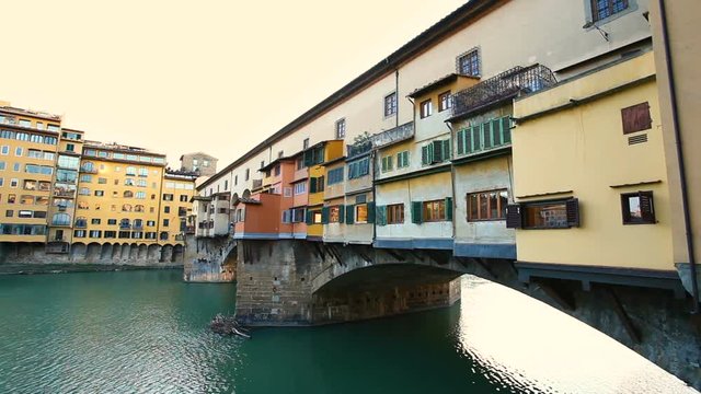 Side view at sunset of Ponte Vecchio in Florence, Italy.