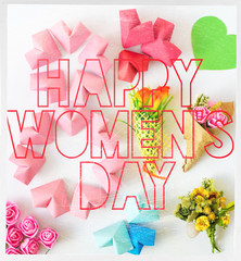 Happy International Women’s Day celebrate on March 8, congratulatory CARD.  rose-color paper hearts shape figure eight 8 on white background 