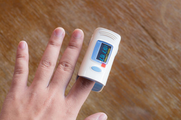 Fingertip pulse oximeter on finger oxygen
