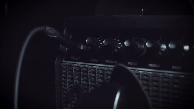 4k Close-up Electric Guitar Amplifier, dolly shot