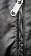 Black Steel zippers fastener in closed and opened positions For Fashion Clothes accessory . background