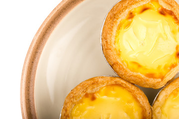 egg tart on white plate macro