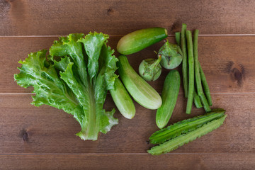 group of vegetable cucumbers,thai eggplants,long beens,Winged beans,lettuce.