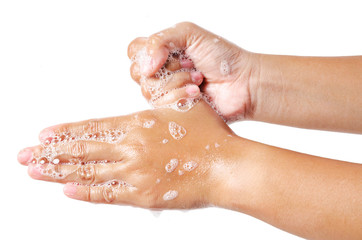 Hands washing with bubble soap.