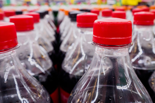 Carbonated soft drink bottles close up