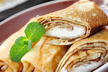 Rolled pancakes with cottage cheese