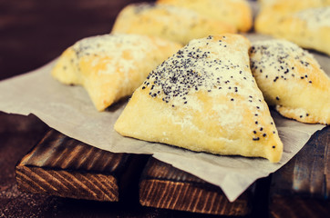 Triangular cookies with poppy seeds