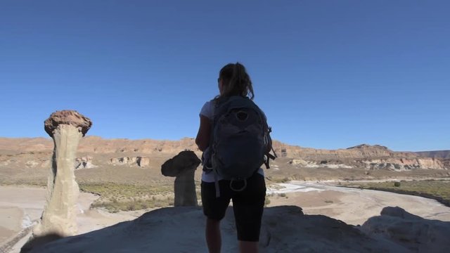 Backpacker Girl exploring Wahweap Hoodoos near Kanab