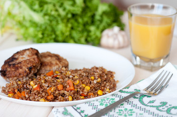 Buckwheat porridge with vegetables and meatballs