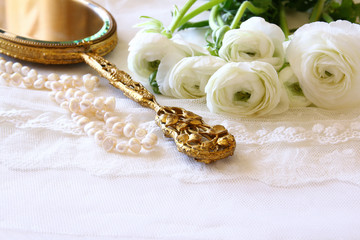 white delicate lace fabric and white flowers