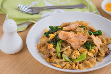 Stir fried rice noodle with pork on plate