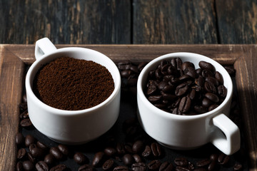 ground coffee and coffee beans in cups