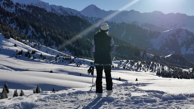 Snowboarder successful young woman adventure to snowy alps mountains, Swiss. Snowboard and ski healthy activities. Footage