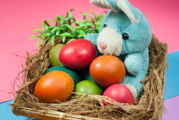 decorating Easter bunny and colorful Easter eggs