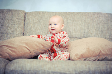 blue-eyed baby on the couch