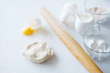 Cooking stages. Preparing dough for pies ingredients on table. © different_nata