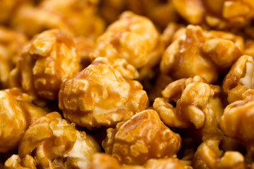 caramel popcorn on a plate macro bokeh